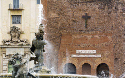 Statue in front of historical building