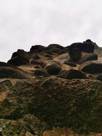 Rock formations on landscape against sky