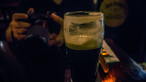 Close-up of beer glass on table