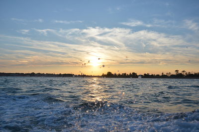 Scenic view of sea against sky at sunset