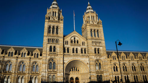 Low angle view of building against blue sky