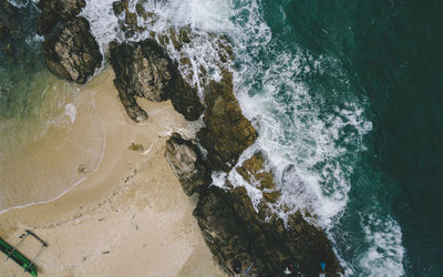 High angle view of water flowing through rocks