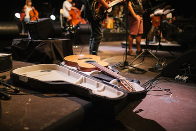 People playing guitar at music concert