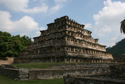 Old temple against cloudy sky