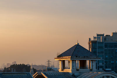 Low angle view of building against sky during sunset