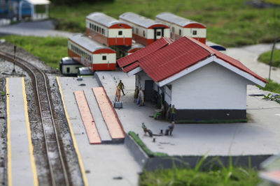 Tilt-shift image of houses and building in city