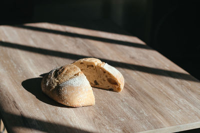 High angle view of bread on cutting board