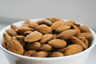 Close-up of almonds in bowls on table