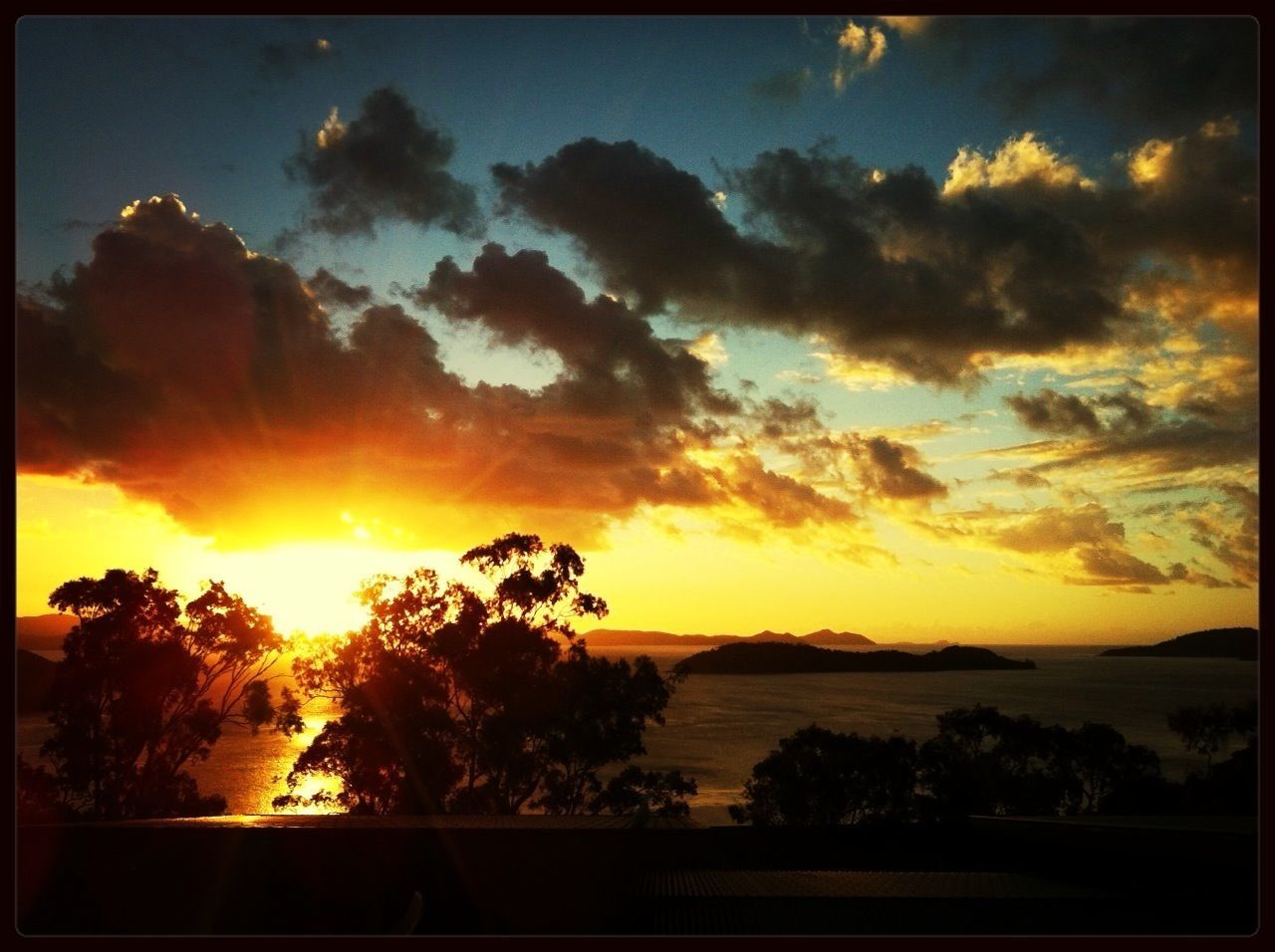 sunset, scenics, tranquil scene, beauty in nature, sky, tranquility, transfer print, sun, tree, silhouette, orange color, nature, idyllic, auto post production filter, cloud - sky, sunlight, water, cloud, sunbeam, landscape