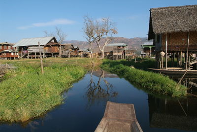 Panoramic view of houses and trees against sky