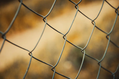 Full frame shot of chainlink fence against sky