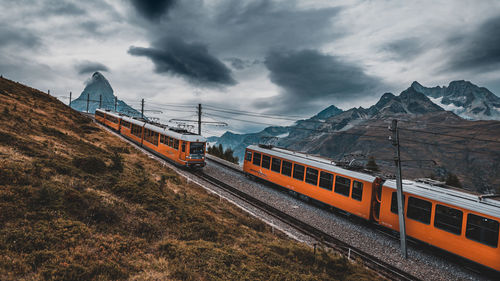 Cogwheel trains against sky