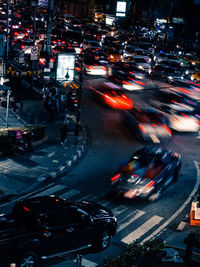 Blurred motion of vehicles on city street at night