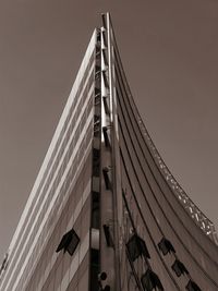 Low angle view of suspension bridge against sky