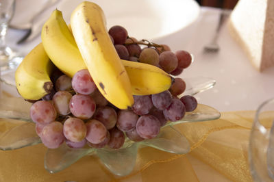 High angle view of grapes in plate on table