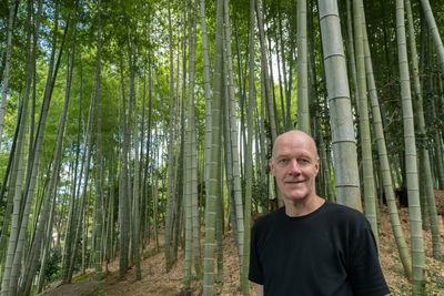 Portrait of smiling young man in forest