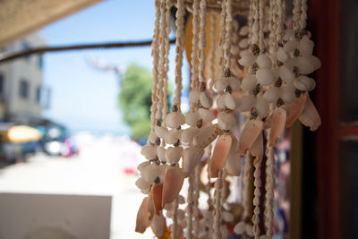 Close-up of decoration hanging against sky