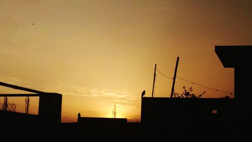 Silhouette of city at sunset