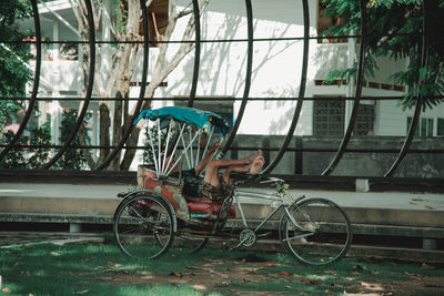 Bicycles parked by building in city