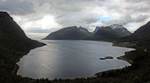 Scenic view of lake and mountains against sky