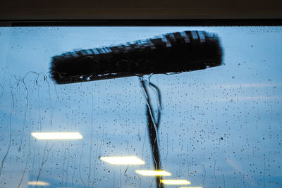 Close-up of wet glass window in rainy season