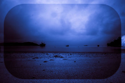 Scenic view of sea against sky at night