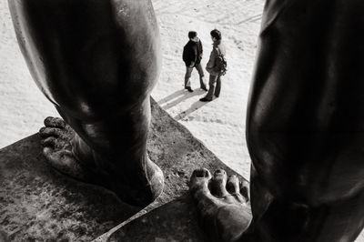 People walking in statue