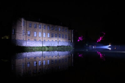 Reflection of illuminated buildings in water