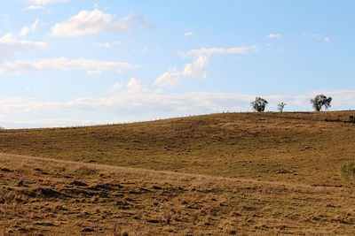 Scenic view of land against sky