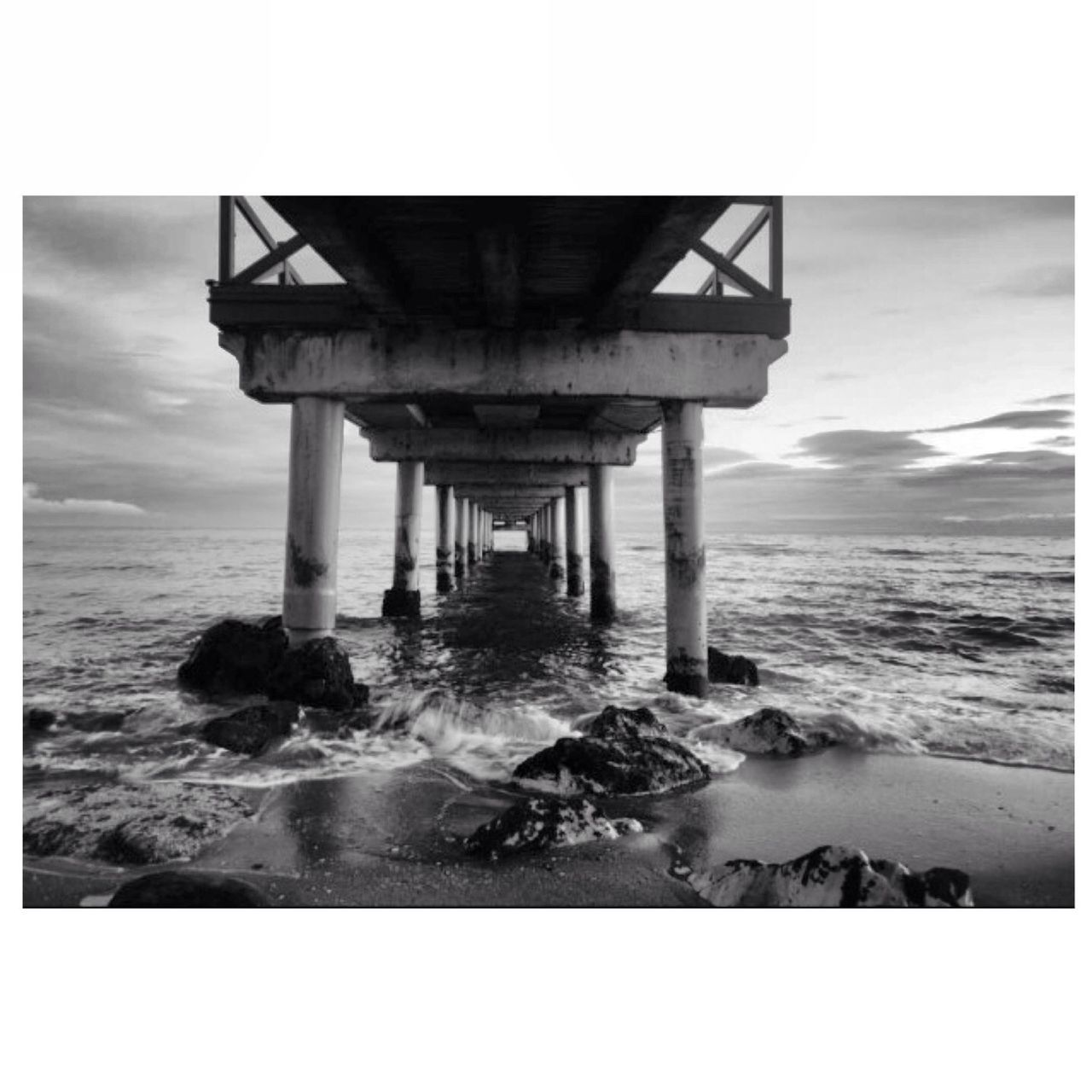 transfer print, sea, water, auto post production filter, beach, horizon over water, sky, shore, built structure, wave, nature, scenics, architecture, sand, tranquility, tranquil scene, surf, beauty in nature, coastline, rock - object