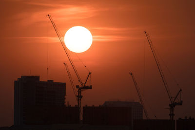 Silhouette of crane at sunset