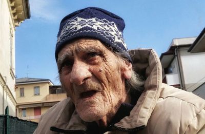 Portrait of man in front of built structure