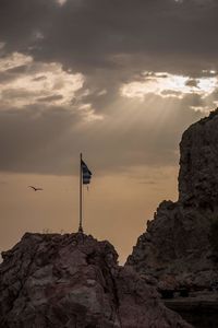 Low angle view of rock formation against sky during sunset