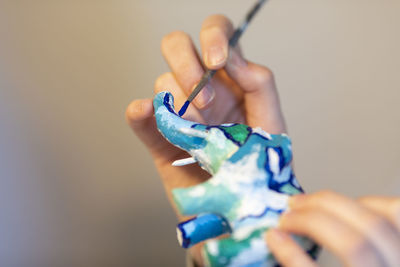 Close-up of man holding paper