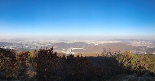 Scenic view of mountains against clear blue sky