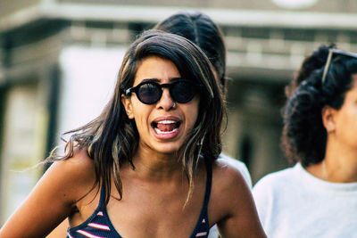 Portrait of young woman wearing sunglasses