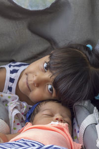 Portrait of girl with baby