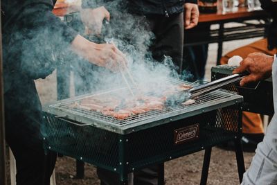 Man preparing food on barbecue grill