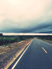 Empty road along landscape