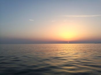 Scenic view of sea against sky at sunset