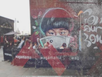 Portrait of boy on glass