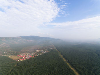 Aerial view of agricultural field against sky