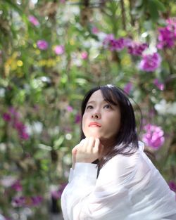 Portrait of young woman standing outdoors