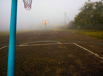 View of basketball hoop in foggy weather