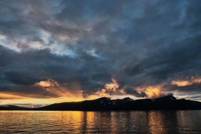 Scenic view of lake against sky during sunset