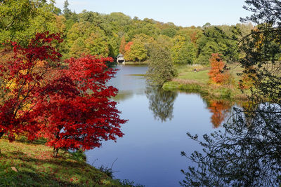 Reflection of trees in lake against sky during autumn