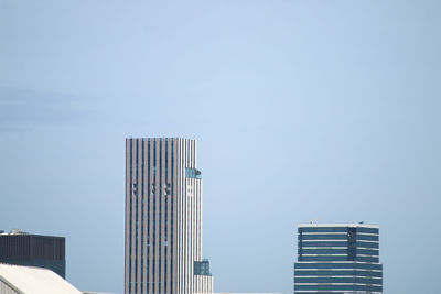 Low angle view of modern buildings against clear sky