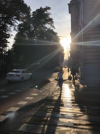 People on city street at sunset