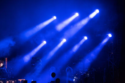 View of illuminated lighting equipment at music concert