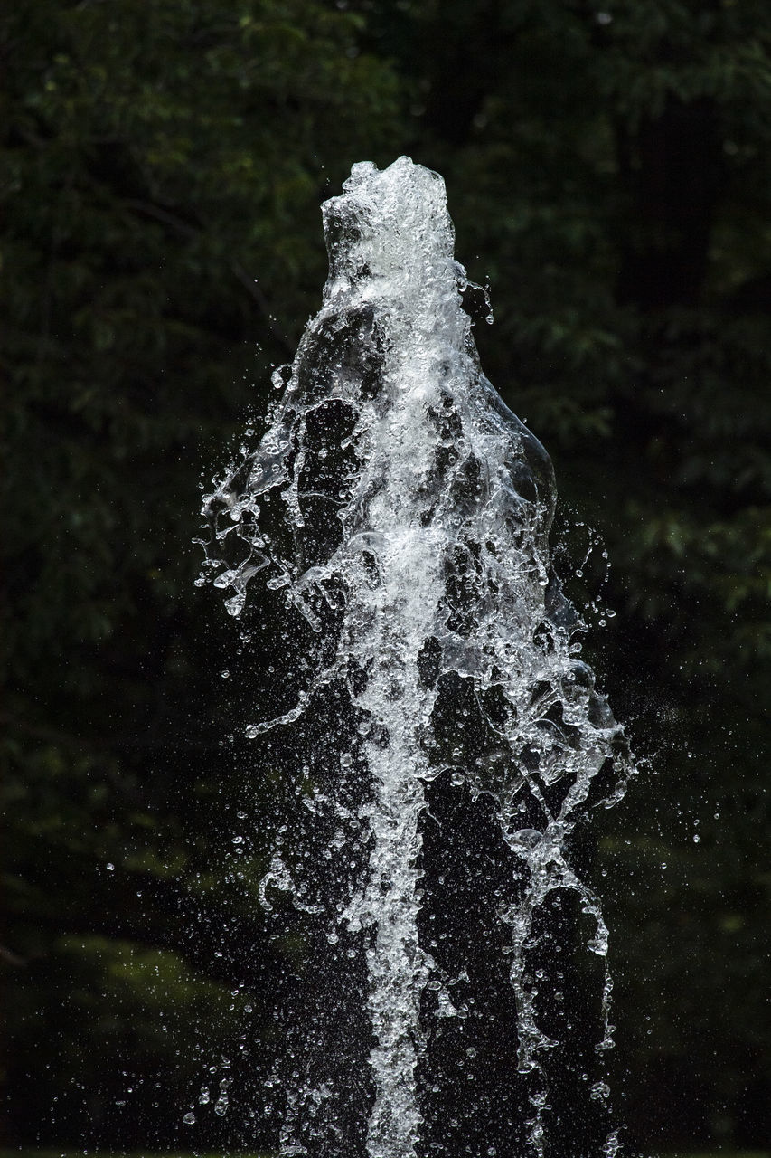 CLOSE-UP OF WATER SPLASHING FOUNTAIN